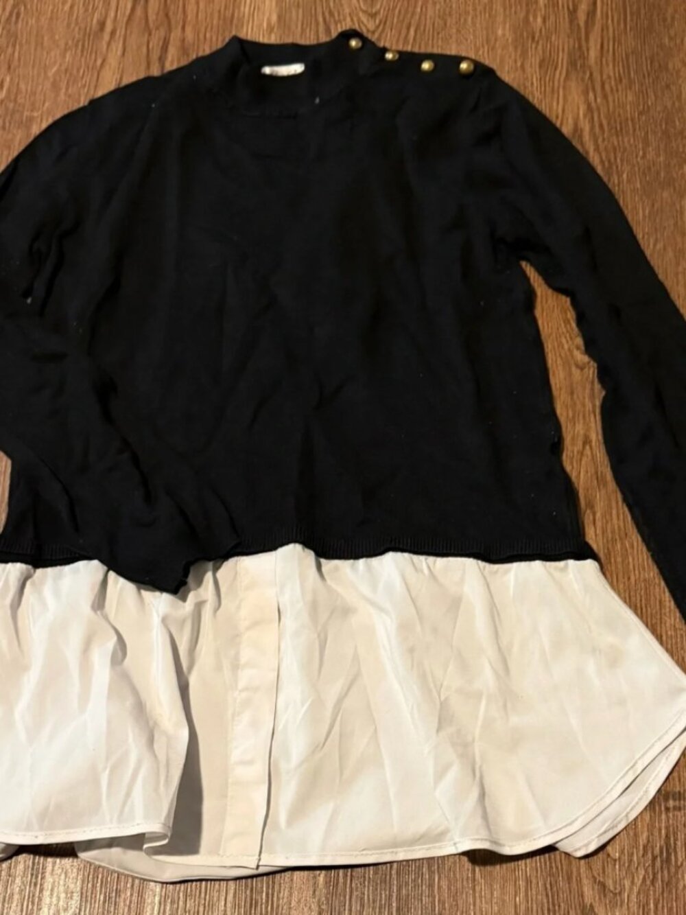 Cielo Black Sweater with Cream Layered Hem and Gold Shoulder Buttons